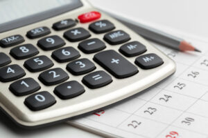 Calculator on table in office.